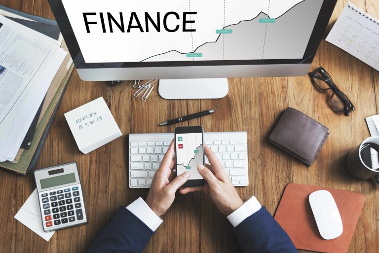 A digital stock exchange board with fluctuating market data and financial charts.